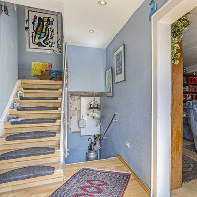 Ratingen-Ost: Doppelhaushälfte mit Carport, Wintergarten  und  großem Grundstück